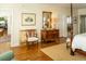 Charming bedroom showcasing wooden furniture, hardwood floors, and comfortable seating at 10 Toms Turnaround Cir, Edisto Island, SC 29438