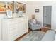 Comfortable bedroom with a dresser and chair, decorated with art and stylish interior design at 10 Toms Turnaround Cir, Edisto Island, SC 29438