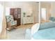 Bright bedroom features built-in cabinets, a comfortable chair, wood shutters, and ample natural light creating a serene retreat at 10 Toms Turnaround Cir, Edisto Island, SC 29438