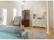 Bright bedroom features built-in cabinets, a comfortable chair, wood shutters, and ample natural light creating a serene retreat at 10 Toms Turnaround Cir, Edisto Island, SC 29438