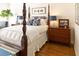 Charming bedroom boasts a four-poster bed, hardwood floors, and decorative accents at 10 Toms Turnaround Cir, Edisto Island, SC 29438