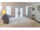 Cozy bedroom with a dresser, French doors, and stylish furnishings, creating a relaxing retreat at 10 Toms Turnaround Cir, Edisto Island, SC 29438