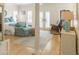 Inviting bedroom features neutral colors, comfortable seating, French doors, and natural light from multiple windows with shutters at 10 Toms Turnaround Cir, Edisto Island, SC 29438