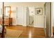Bedroom with hardwood floors and doors that lead to the bathroom at 10 Toms Turnaround Cir, Edisto Island, SC 29438