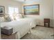 Comfortable bedroom with two beds, an area rug, and a large painting creating a relaxing retreat at 10 Toms Turnaround Cir, Edisto Island, SC 29438