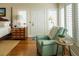 Comfortable bedroom features natural light with an accent chair and wooden dresser at 10 Toms Turnaround Cir, Edisto Island, SC 29438