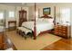 Elegant bedroom showcasing a luxurious bed, hardwood floors, and natural light at 10 Toms Turnaround Cir, Edisto Island, SC 29438