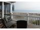 Relax on this beachfront deck featuring comfortable seating and stunning ocean views for a serene outdoor experience at 10 Toms Turnaround Cir, Edisto Island, SC 29438