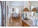 Inviting dining room featuring hardwood floors, shutters, and elegant décor at 10 Toms Turnaround Cir, Edisto Island, SC 29438