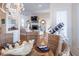 Open dining area with hardwood floors and decorative table setting connects to living room at 10 Toms Turnaround Cir, Edisto Island, SC 29438