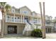 Beautiful coastal home featuring covered parking and a large porch, ideal for outdoor living at 10 Toms Turnaround Cir, Edisto Island, SC 29438