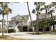 Charming two-story coastal home featuring a spacious porch and beautiful architectural details at 10 Toms Turnaround Cir, Edisto Island, SC 29438