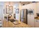 Kitchen island features granite countertop with stainless steel sink and appliances at 10 Toms Turnaround Cir, Edisto Island, SC 29438