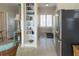 Bright and airy kitchen adjacent to the living area with stainless steel appliances and white cabinetry at 10 Toms Turnaround Cir, Edisto Island, SC 29438