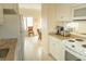 View of the kitchen with a refrigerator, microwave, and granite countertops at 10 Toms Turnaround Cir, Edisto Island, SC 29438
