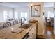 Bright kitchen featuring granite countertops, a sink, and an open floor plan with a view of the living area at 10 Toms Turnaround Cir, Edisto Island, SC 29438