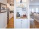 Well-appointed kitchenette and bar area, perfect for entertaining, with barstool seating and wine storage at 10 Toms Turnaround Cir, Edisto Island, SC 29438
