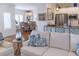 A lovely living room featuring stylish furniture and a view into the dining and kitchen areas at 10 Toms Turnaround Cir, Edisto Island, SC 29438