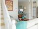 Relaxed living area with adjacent staircase and seamless flow to the kitchen space, enhancing the home's connectivity at 10 Toms Turnaround Cir, Edisto Island, SC 29438