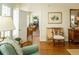 Cozy living room featuring hardwood floors, comfortable seating, and a view into other rooms at 10 Toms Turnaround Cir, Edisto Island, SC 29438
