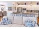 Comfortable living room offers a clear view into the modern kitchen with stainless steel appliances and bar seating at 10 Toms Turnaround Cir, Edisto Island, SC 29438