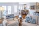 Bright living area showcasing comfortable seating and glimpses of the adjacent dining area and outdoor patio at 10 Toms Turnaround Cir, Edisto Island, SC 29438