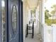 Inviting porch featuring classic columns and a stylish front door, offering a welcoming entrance to the home at 10 Toms Turnaround Cir, Edisto Island, SC 29438