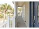 Charming porch with elegant columns and lush greenery, a serene outdoor space that enhances curb appeal at 10 Toms Turnaround Cir, Edisto Island, SC 29438