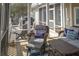 Screened porch with gray outdoor furniture and a view of the outdoor grill at 10 Toms Turnaround Cir, Edisto Island, SC 29438