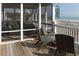 Enjoy this screened porch with ample seating and partial ocean views, perfect for relaxation and entertaining guests at 10 Toms Turnaround Cir, Edisto Island, SC 29438