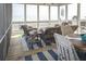 Beautiful screened porch with wicker furniture and ocean views at 10 Toms Turnaround Cir, Edisto Island, SC 29438
