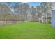 Large grassy backyard with a pool and a multilevel deck/balcony system at 1012 Denali Ct, Summerville, SC 29483