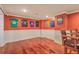 Spacious basement features wood floors, half wall trim, recessed lighting, and is decorated with sports memorabilia at 1012 Denali Ct, Summerville, SC 29483