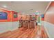 Basement bar area features wood floors, recessed lighting, bar seating, and ample storage for entertaining guests at 1012 Denali Ct, Summerville, SC 29483