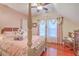 Charming bedroom with a four poster bed, wood floors, and a ceiling fan at 1012 Denali Ct, Summerville, SC 29483
