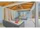Cabana with an outdoor entertaining area featuring wicker furniture, a TV, a ceiling fan, and decorative curtains at 1012 Denali Ct, Summerville, SC 29483