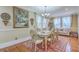 Inviting dining room with hardwood floors, natural light, and stylish chandelier at 1012 Denali Ct, Summerville, SC 29483