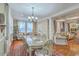 Elegant dining area with seating, natural light and hardwood flooring at 1012 Denali Ct, Summerville, SC 29483
