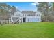 Exterior view of the back of the home showing a large yard with a multilevel deck/balcony system at 1012 Denali Ct, Summerville, SC 29483