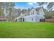 Exterior view of the back of the home showing a large yard with a pool and a multilevel deck/balcony system at 1012 Denali Ct, Summerville, SC 29483