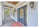 Close-up of a beautiful front door with decorative glass panels, sidelights, and stylish outdoor lighting fixtures on the porch at 1012 Denali Ct, Summerville, SC 29483