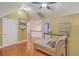 Upstairs hallway featuring wood floors, beige walls, and a chaise lounge for seating at 1012 Denali Ct, Summerville, SC 29483