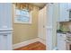 Spacious kitchen area featuring hardwood floors, a window, and ample cabinet space at 1012 Denali Ct, Summerville, SC 29483