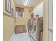 Clean laundry room with modern washer and dryer, storage cabinets, and natural light at 1012 Denali Ct, Summerville, SC 29483