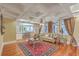 Spacious living room with coffered ceilings, hardwood floors, and abundant natural light at 1012 Denali Ct, Summerville, SC 29483