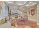 Bright living room boasts a fireplace, hardwood floors, and custom shelving at 1012 Denali Ct, Summerville, SC 29483