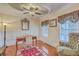 Office area featuring windows, hardwood floors, and chair-rail details at 1012 Denali Ct, Summerville, SC 29483