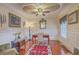 Elegant office featuring detailed trim, hardwood floors, and a statement ceiling fan at 1012 Denali Ct, Summerville, SC 29483