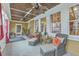 Bright sunroom with tile floors, ceiling fans, and plenty of natural light at 1012 Denali Ct, Summerville, SC 29483