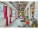 Bright sunroom with tile floors, ceiling fans, and large windows with red accents at 1012 Denali Ct, Summerville, SC 29483